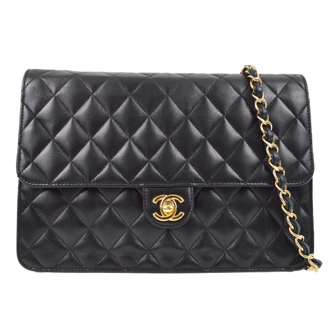 Chanel Black Lambskin Medium Classic Flap Shoulder Bag: Chanel Black Lambskin Medium Classic Flap Shoulder Bag Elevate your style with this Chanel Black Lambskin Turnlock Medium Half Flap Shoulder Bag. This classic piece features a luxurious lambskin exter