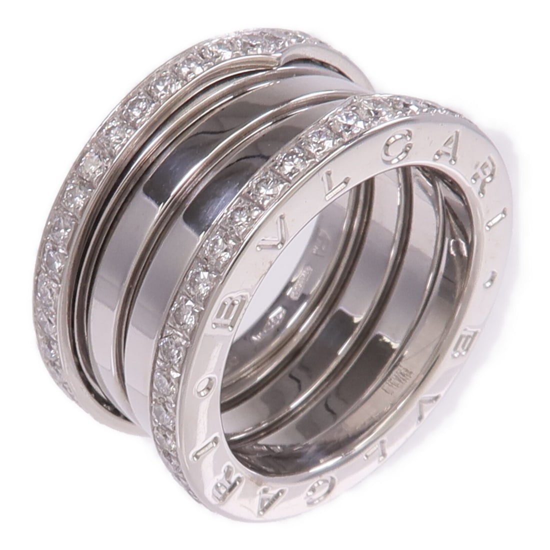B.Zero1 Three-Band Diamond Ring in 18K White Gold Size 6.25 by BVLGARI: B.Zero1 Three-Band Diamond Ring in 18K White Gold Size 6.25 by BVLGARI This BVLGARI B.Zero1 3 Band Ring features elegant 18K white gold craftsmanship and is adorned with diamonds. Italian-made, the ri