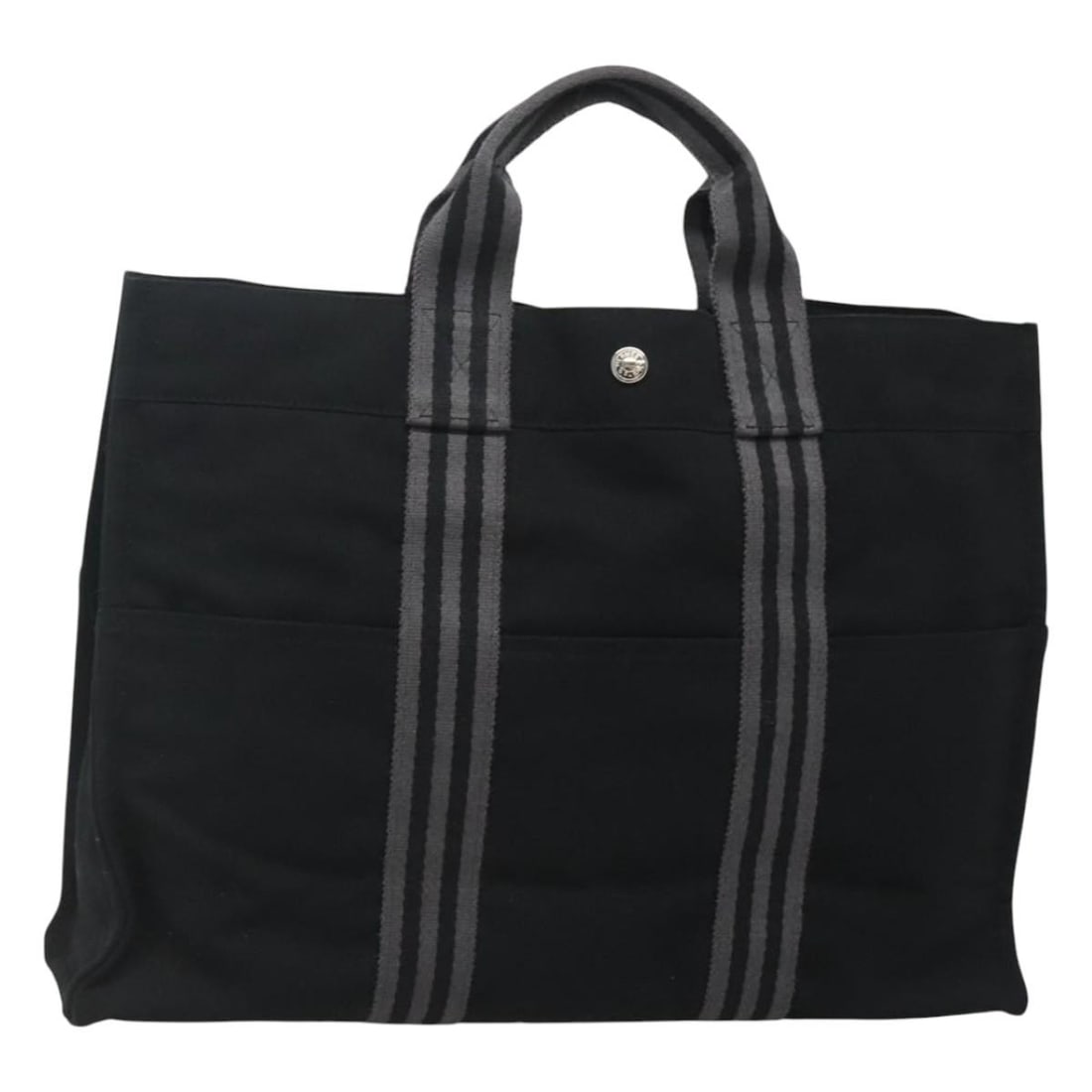 Fourre Tout MM Canvas Tote Black Silver by Hermes France: Fourre Tout MM Canvas Tote Black Silver by Hermes France This Hermes Fourre Tout MM handbag is crafted from black canvas with silver-tone accents. Designed for women, it features a spacious interior a