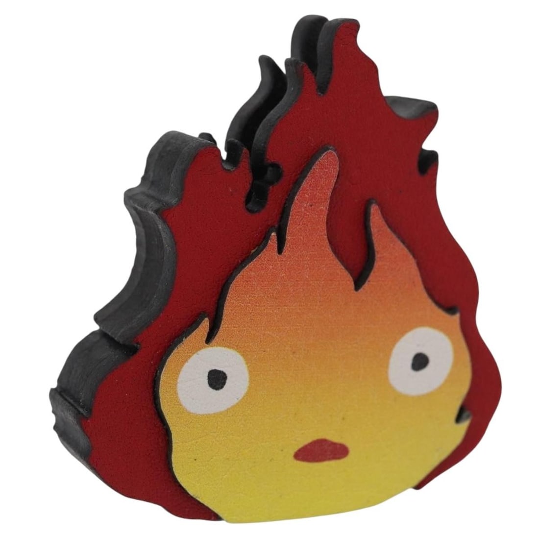 LOEWE Calcifer leather charm from Howl's Moving Castle: LOEWE Calcifer leather charm from Howl's Moving Castle This LOEWE charm features Calcifer from Studio Ghibli's Howl's Moving Castle. Crafted from red leather, the accessory is designed for women and c