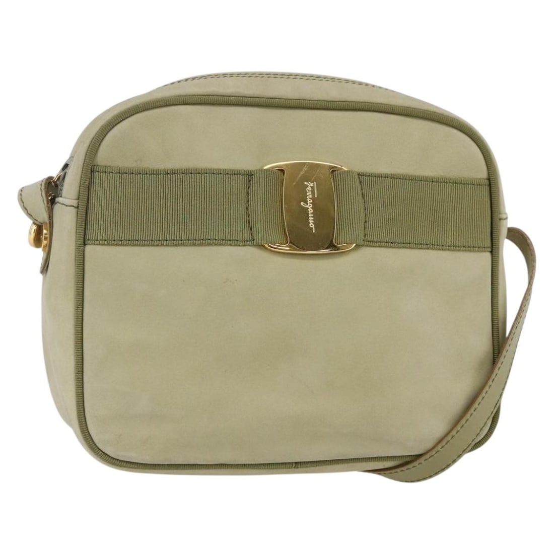 Green Suede Vala Shoulder Purse by Salvatore Ferragamo: Green Suede Vala Shoulder Purse by Salvatore Ferragamo This pre-owned Salvatore Ferragamo Vala shoulder bag for women features green suede material and a compact design. It shows signs of use includin