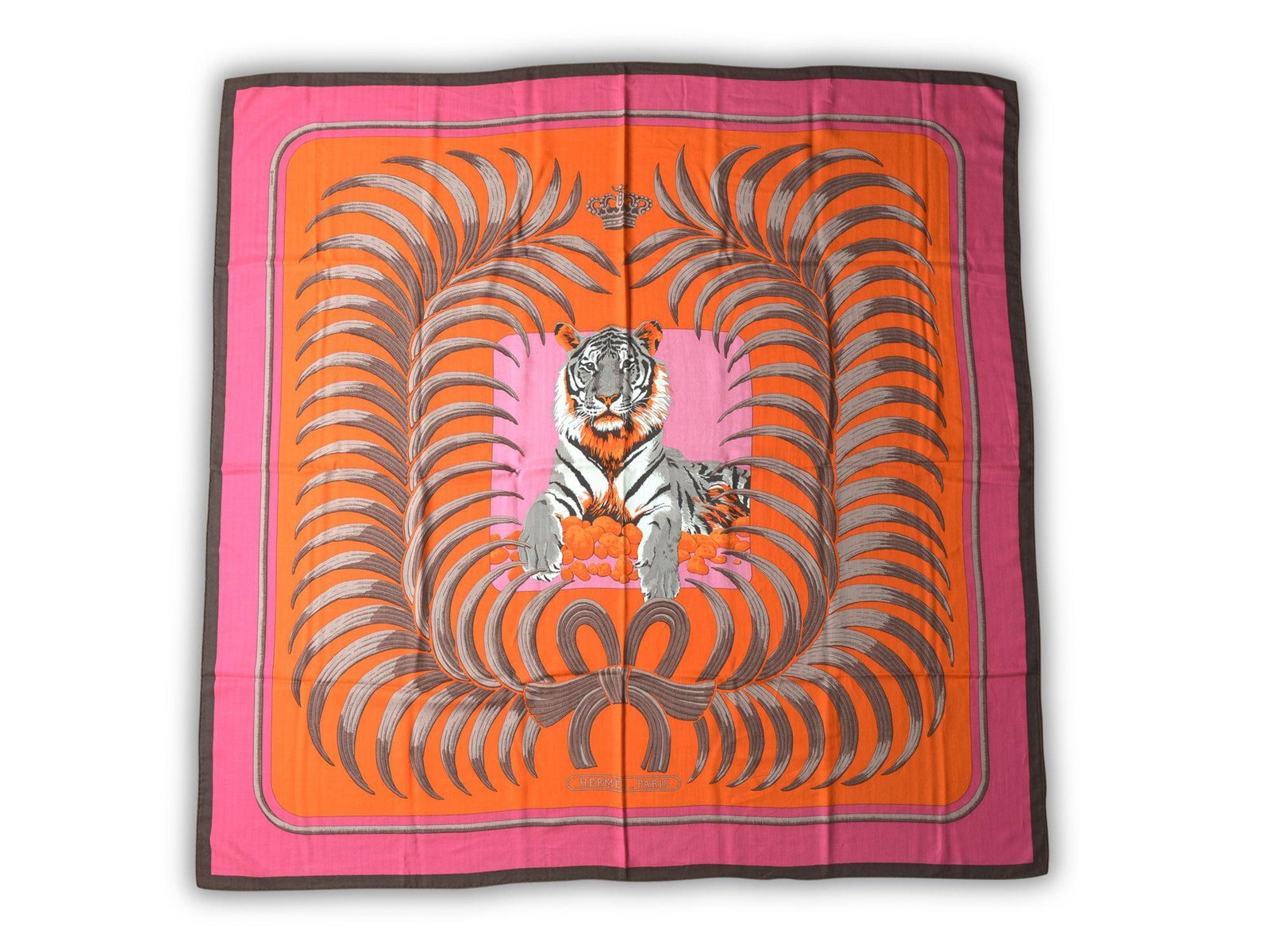 Le Tigre Royal cashmere scarf with tiger motif and original box by Hermes: Le Tigre Royal cashmere scarf with tiger motif and original box by Hermes Hermes "Le Tigre Royal" cashmere shawl features a central tiger motif with orange and pink borders. This un-used scarf comes w