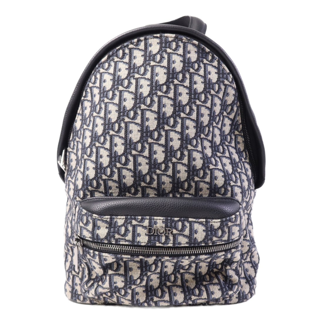 Dior Black Canvas Oblique Rucksack Backpack: Dior Black Canvas Oblique Rucksack Backpack This Dior rucksack backpack features the signature Oblique design in a beige and black color combination. Crafted from durable canvas, it offers a stylish a