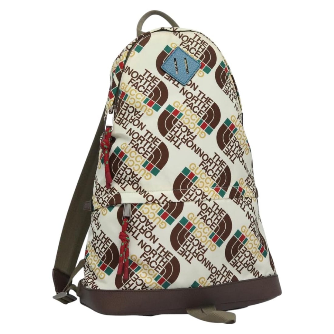 Nylon Cream Backpack by Gucci x The North Face 650288 Italy: Nylon Cream Backpack by Gucci x The North Face 650288 Italy This is a GUCCI x THE NORTH FACE backpack crafted from cream and brown nylon. Designed for women, it features a spacious interior and a prac