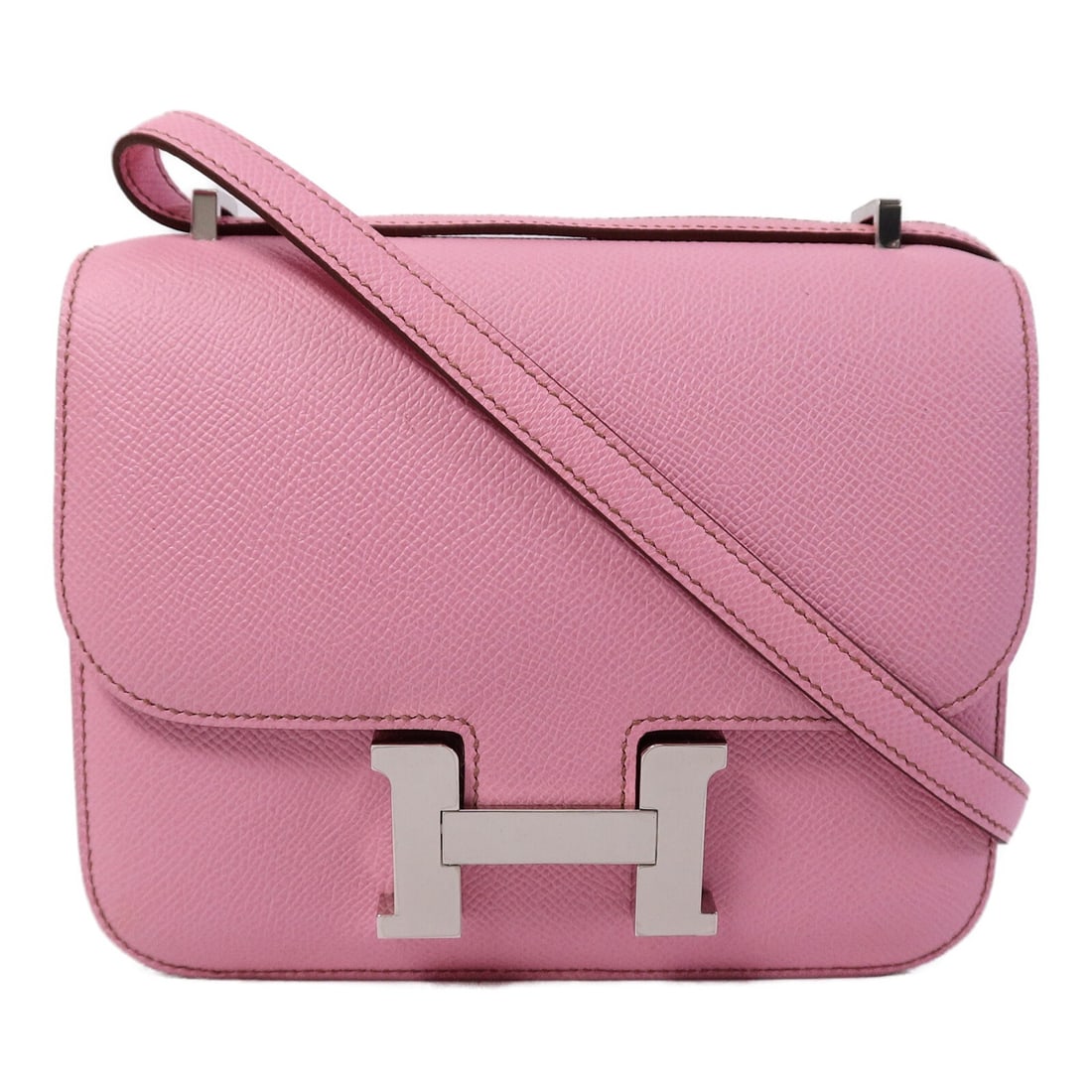 Hermes Constance Mini Pink Epsom Leather Shoulder Bag SHW: Hermes Constance Mini Pink Epsom Leather Shoulder Bag SHW This Hermes Constance Mini shoulder bag is crafted from Epsom calfskin leather in a striking bubblegum pink color. Featuring silver hardware, 
