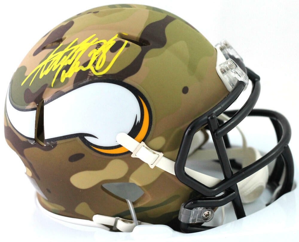 Minnesota Vikings Camo Mini Helmet Signed by Adrian Peterson Beckett Authenticated: Minnesota Vikings Camo Mini Helmet Signed by Adrian Peterson Beckett Authenticated This is a pre-owned Minnesota Vikings camo Speed mini helmet autographed by Adrian Peterson. The signature has been a