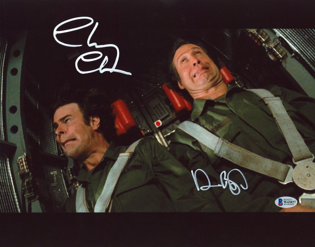 Autographed 11x14 Spies Like Us Photo Signed by Chevy Chase and Dan Aykroyd BAS COA: Autographed 11x14 Spies Like Us Photo Signed by Chevy Chase and Dan Aykroyd BAS COA This 11x14 photograph from the film "Spies Like Us" features a G-Force training scene and has been personally signed