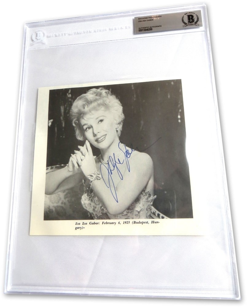 Zsa Zsa Gabor Beckett Authenticated Signed Magazine Photograph Legendary Actress: Zsa Zsa Gabor Beckett Authenticated Signed Magazine Photograph Legendary Actress This is an original magazine photo autographed by legendary actress Zsa Zsa Gabor. The signed photograph comes authenti