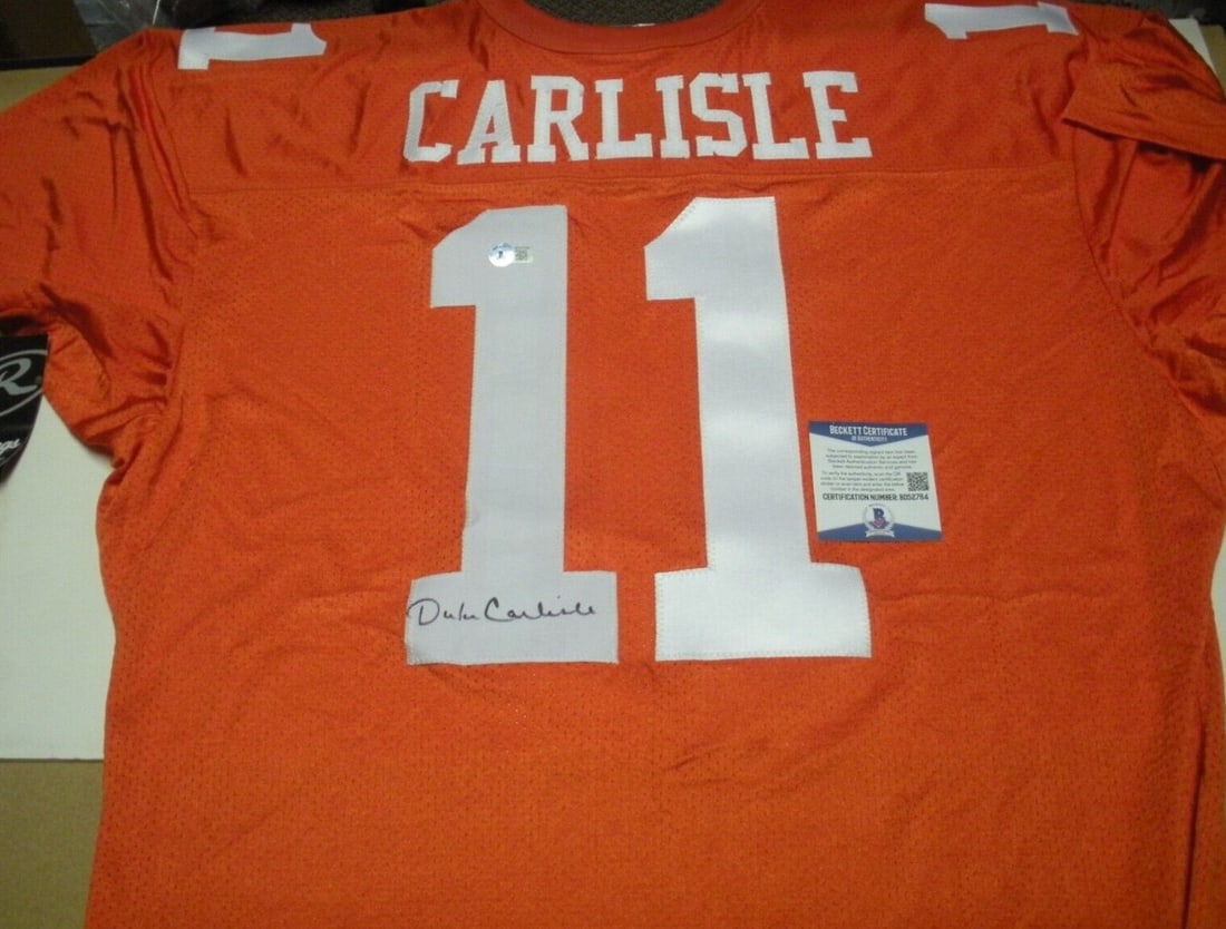 Official Rawlings Football Jersey Signed by Duke Carlisle Texas Hookem Beckett COA: Official Rawlings Football Jersey Signed by Duke Carlisle Texas Hookem Beckett COA This is an official licensed Rawlings football jersey signed by Duke Carlisle. The jersey is an original collectible 