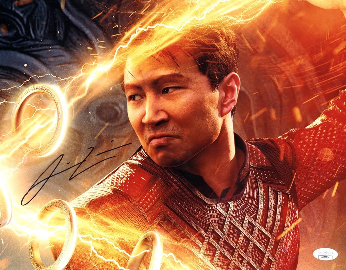 Simu Liu Signed 11x14 Photo Shang-Chi JSA Authenticated: Simu Liu Signed 11x14 Photo Shang-Chi JSA Authenticated This stunning 11x14 photograph features Simu Liu, the star of "Shang-Chi and the Legend of the Ten Rings," and is adorned with his authentic aut