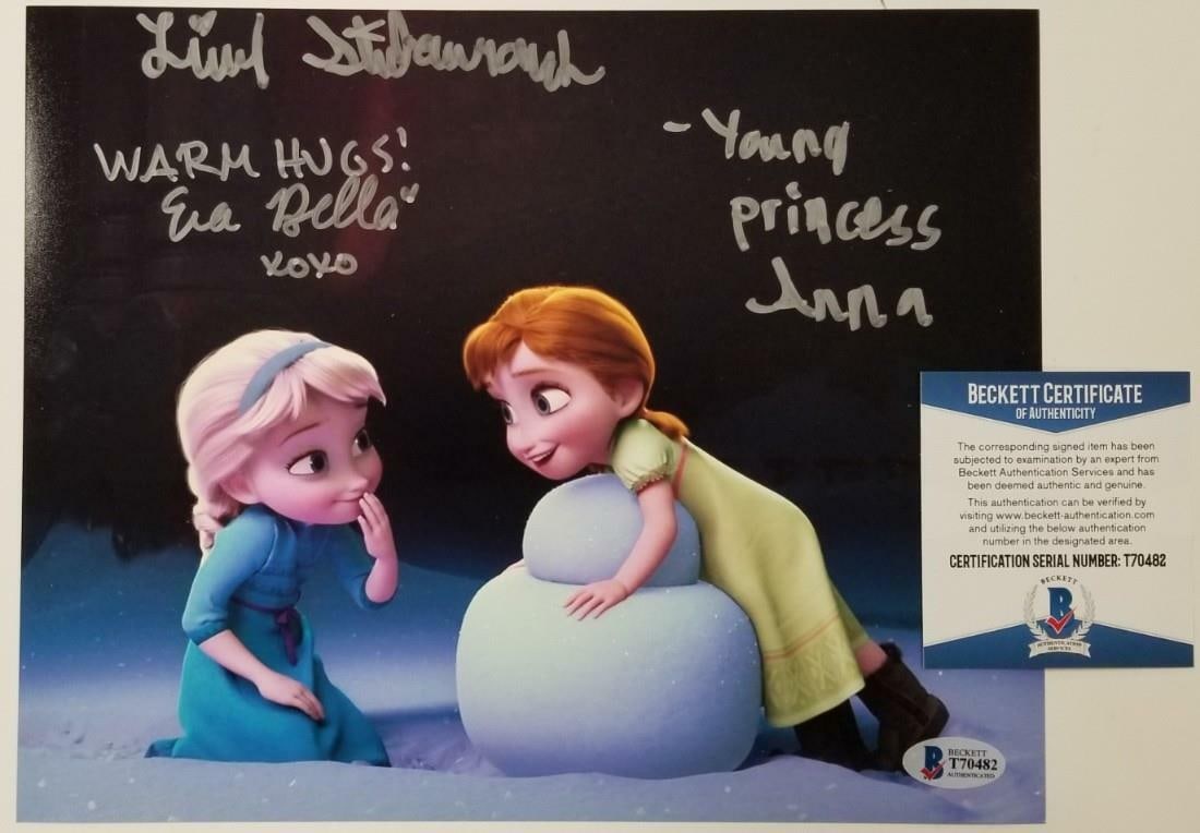 Signed Frozen 8x10 Photo by Livvy Stubenrauch and Eva Bella BAS Authenticated: Signed Frozen 8x10 Photo by Livvy Stubenrauch and Eva Bella BAS Authenticated This original 8x10 photograph from Disney's Frozen features the signatures of Livvy Stubenrauch and Eva Bella, the voices 