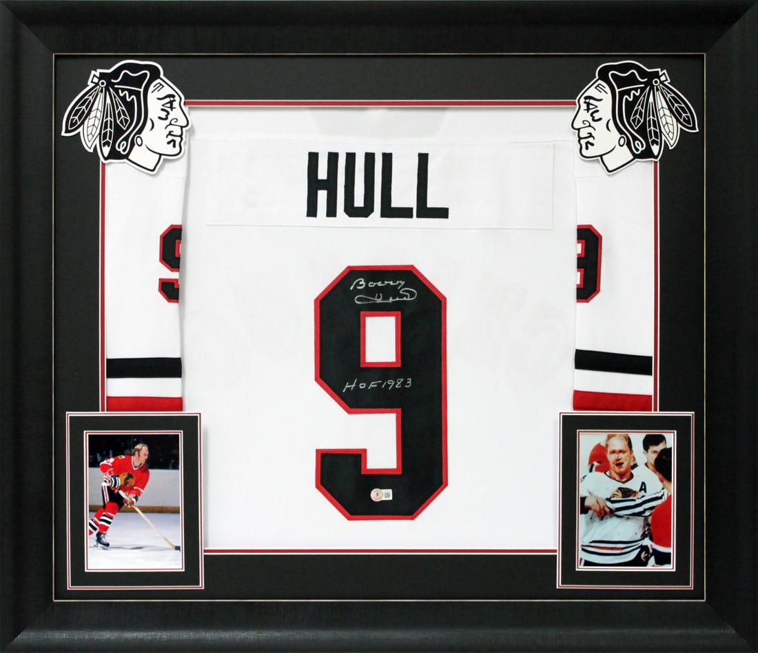 Bobby Hull Autographed Framed Jersey HOF 1983 Chicago Blackhawks Beckett COA: Bobby Hull Autographed Framed Jersey HOF 1983 Chicago Blackhawks Beckett COA Celebrate the legacy of Bobby Hull with this authentic signed white pro style framed jersey. This remarkable piece features