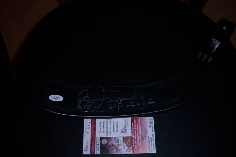Hockey Stick End Autographed by Bernie Federko with JSA COA: Hockey Stick End Autographed by Bernie Federko with JSA COA This is a pre-owned hockey stick end signed by Bernie Federko, an NHL player for the St. Louis Blues. The item is original and comes with JS
