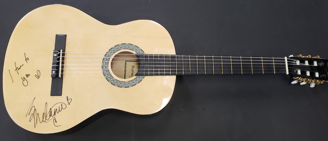 Melanie C Hand Signed Guitar Spice Girls Global Authentics Certified: Melanie C Hand Signed Guitar Spice Girls Global Authentics Certified This is an authentic autographed guitar by Melanie C of the iconic Spice Girls. The guitar features the signature of Melanie C, pro