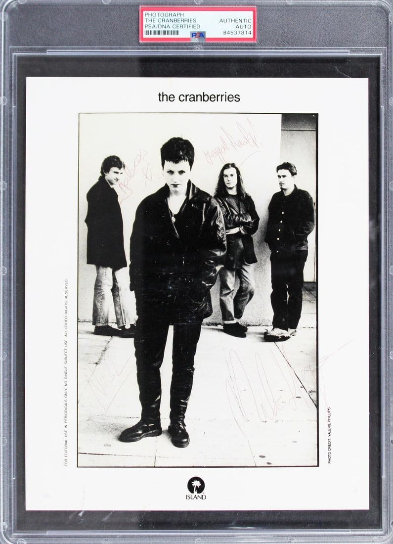 The Cranberries Signed 8x10 Photo by O'Riordan Lawler Hogan PSA Authenticated: The Cranberries Signed 8x10 Photo by O'Riordan Lawler Hogan PSA Authenticated This original 8x10 promotional photo features the signatures of Dolores O'Riordan, Fergal Lawler, Mike Hogan, and Noel Hog
