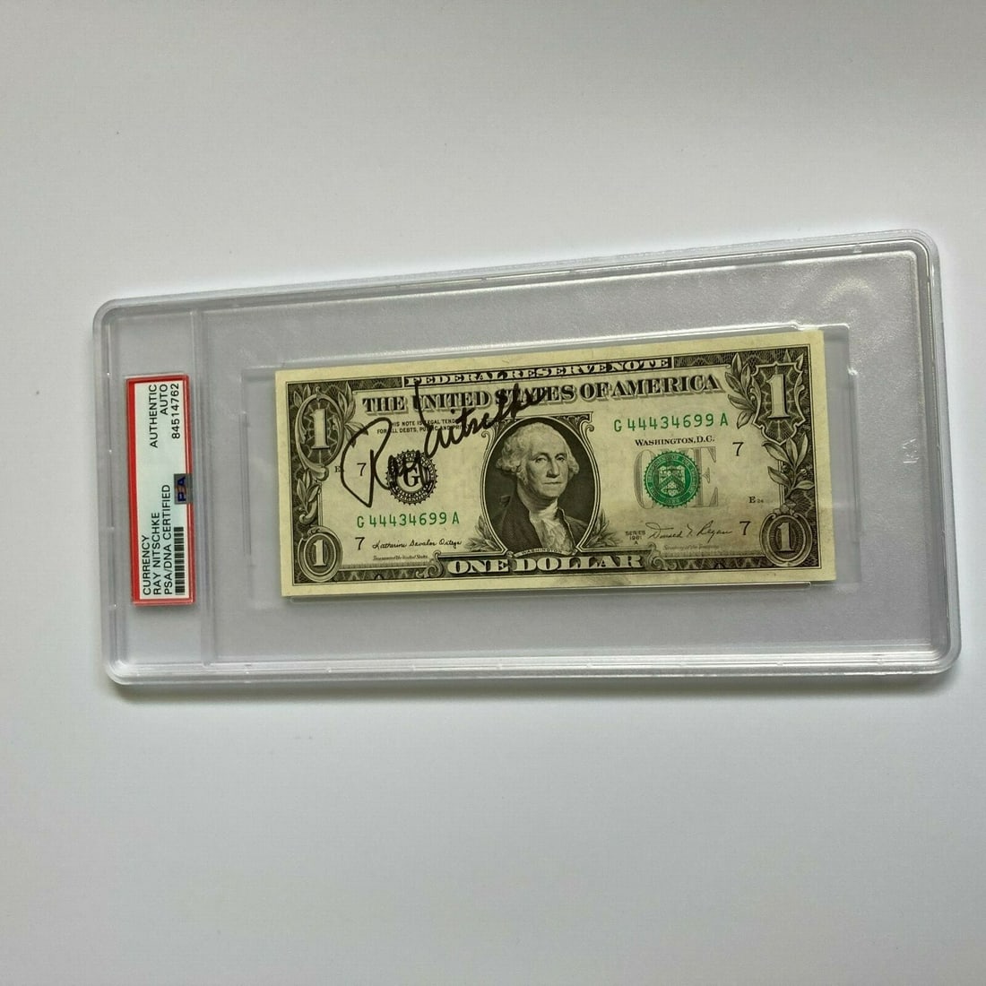 Ray Nitschke Signed $1 Bill with PSA DNA COA NFL Collectible: Ray Nitschke Signed $1 Bill with PSA DNA COA NFL Collectible This is a signed autographed $1 one dollar bill featuring the signature of Ray Nitschke, a renowned NFL player. The bill has been authentic