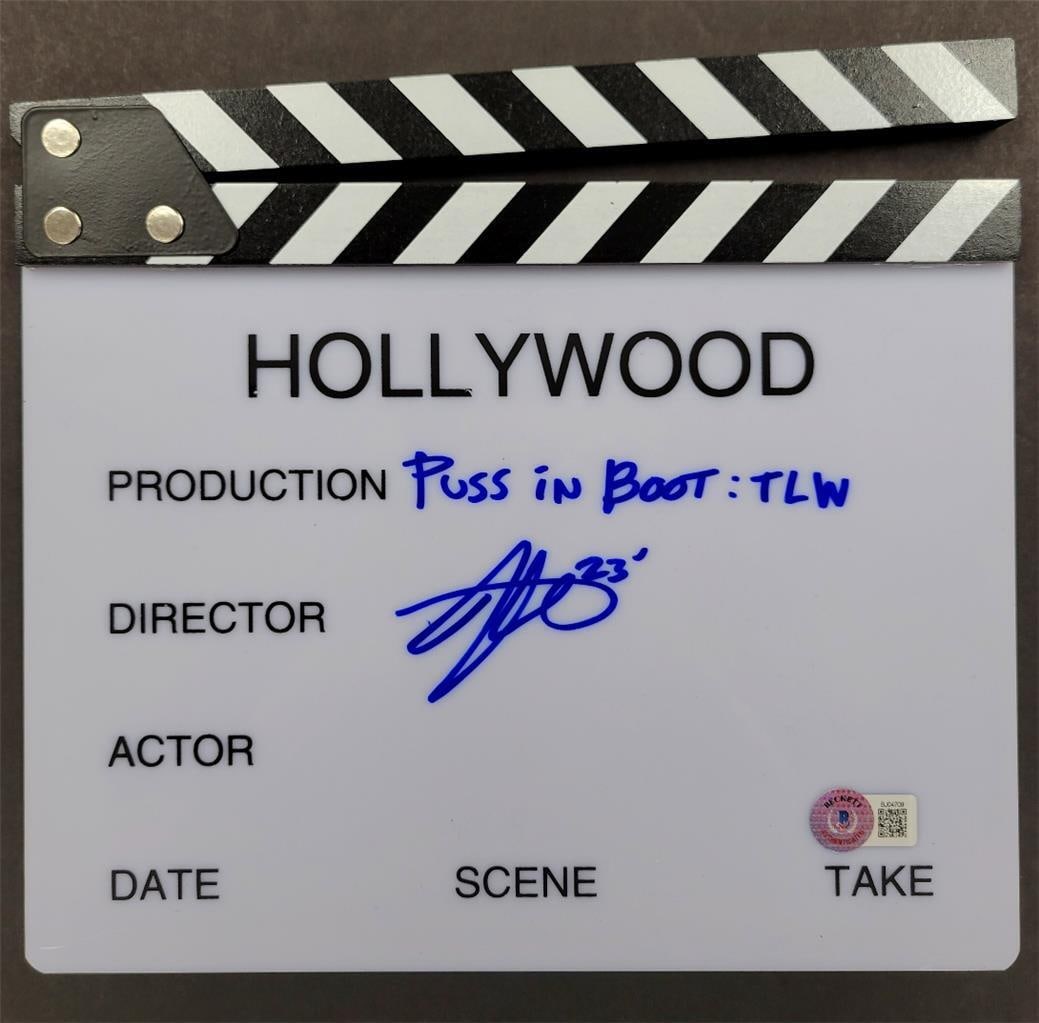 Puss in Boots 2 director clapboard signed by Joel Crawford Beckett authenticated: Puss in Boots 2 director clapboard signed by Joel Crawford Beckett authenticated This is an original director's clapboard signed by Joel Crawford, associated with the movie Puss in Boots 2. The autogr