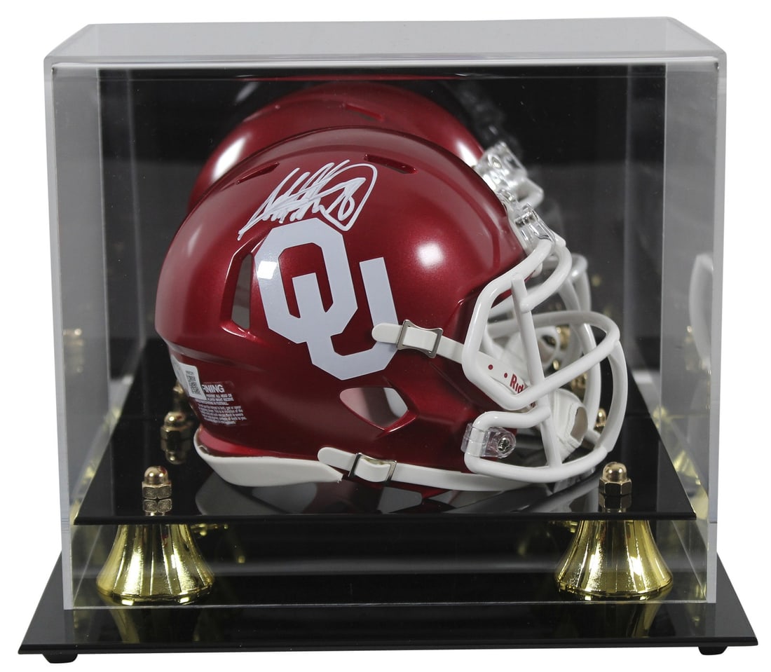 Adrian Peterson Signed Oklahoma Sooners Mini Helmet with Beckett Authentication: Adrian Peterson Signed Oklahoma Sooners Mini Helmet with Beckett Authentication This authentic Adrian Peterson signed Speed Mini Helmet features a sleek design and comes with a UV mirrored back acryli