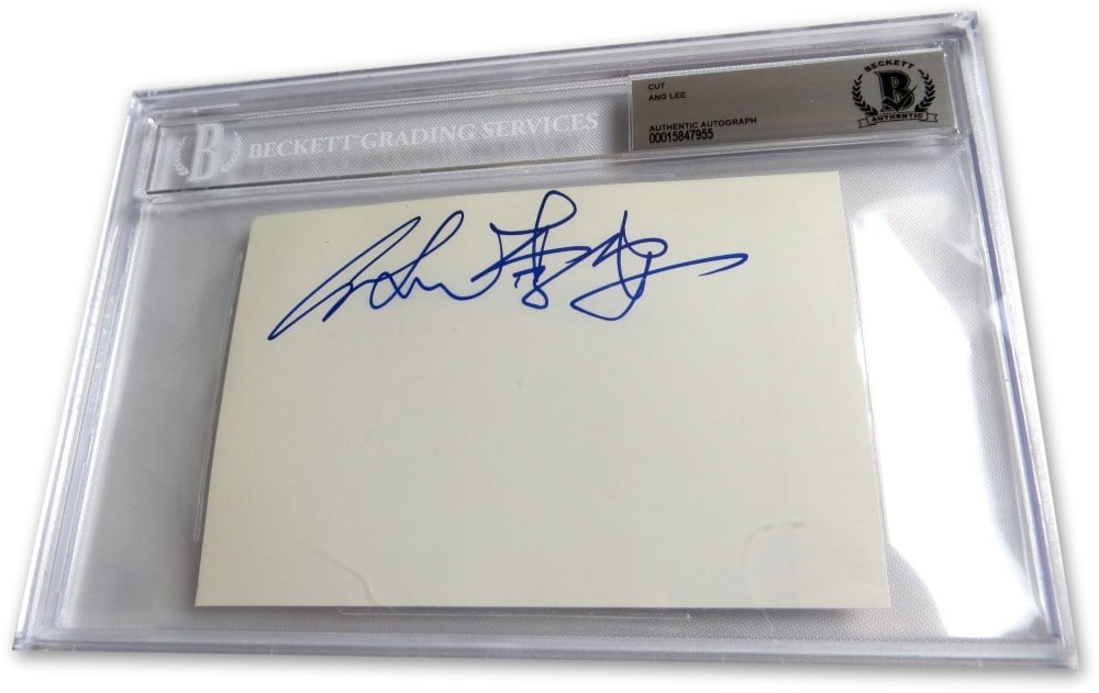Ang Lee Autograph Cut Signature Beckett Authenticated 6 x 9 Slab: Ang Lee Autograph Cut Signature Beckett Authenticated 6 x 9 Slab This is an original cut signature card autographed by the acclaimed director Ang Lee, known for his work on "Life of Pi." The signature