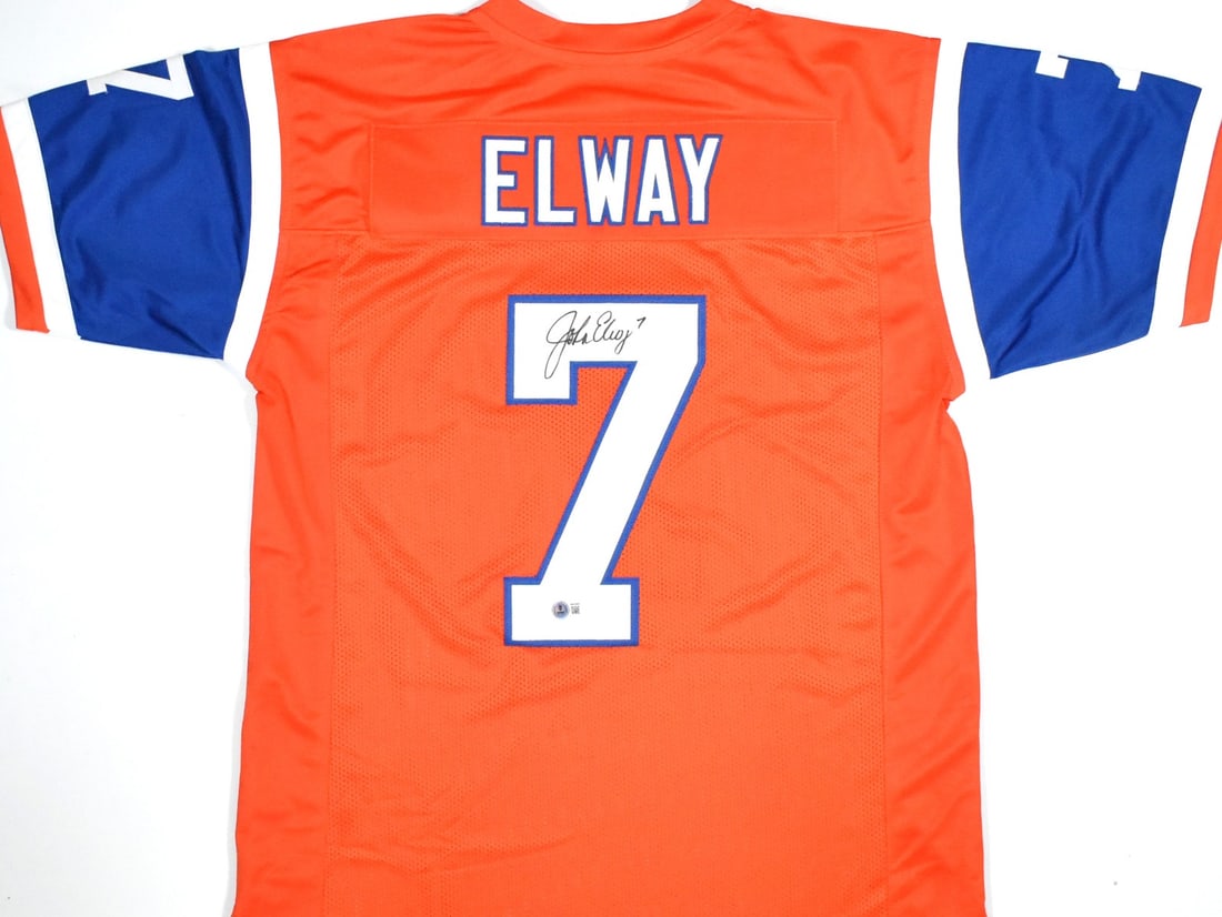 Signed Orange Football Jersey John Elway Beckett Authenticated: Signed Orange Football Jersey John Elway Beckett Authenticated This is an orange pro style jersey autographed by John Elway. The jersey is from the Denver Broncos and is an original item, not a reprod