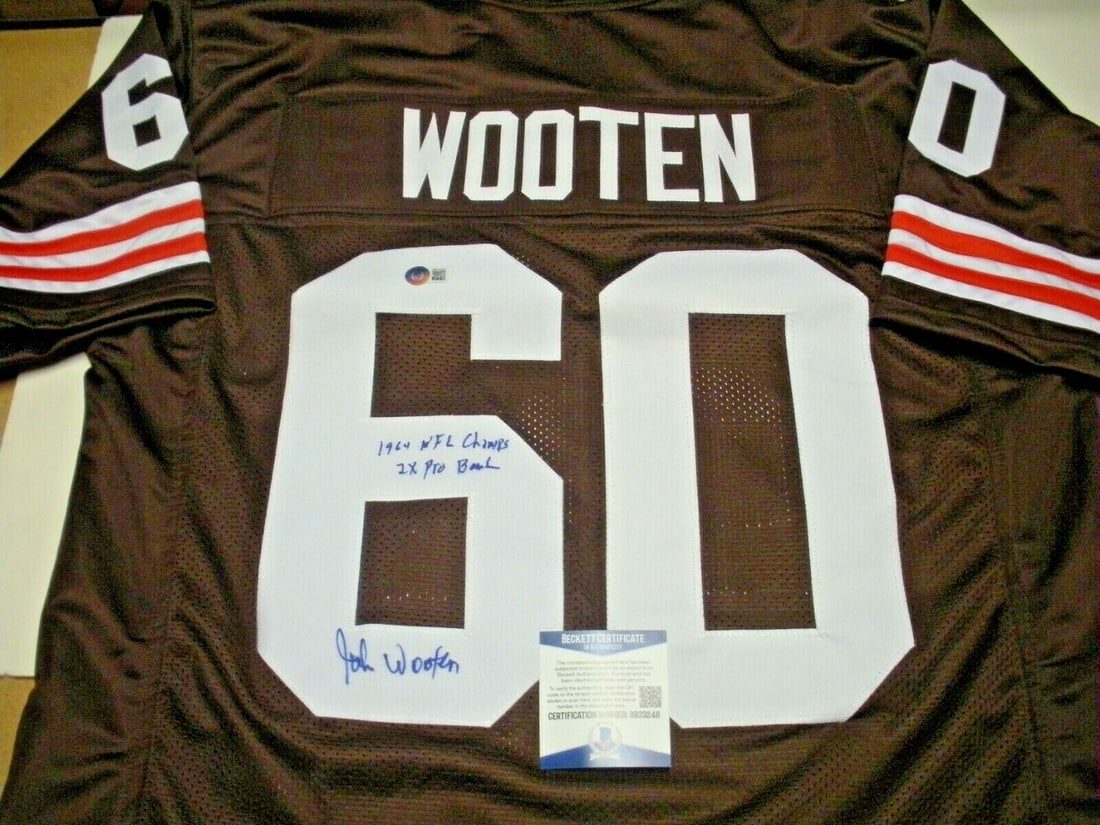 Signed John Wooten Cleveland Browns 1964 Champions Jersey with Beckett COA: Signed John Wooten Cleveland Browns 1964 Champions Jersey with Beckett COA This is a pre-owned Cleveland Browns jersey signed by John Wooten, commemorating the 1964 championship team. The jersey is an