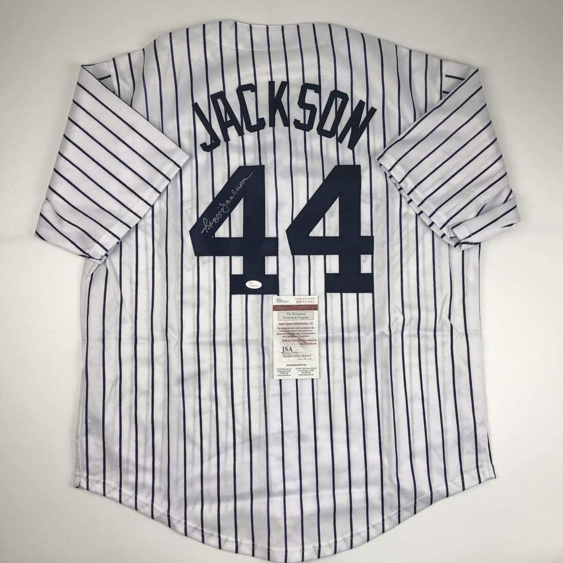 Reggie Jackson Autographed Yankees Pinstripe Jersey with JSA COA (1 of 4)