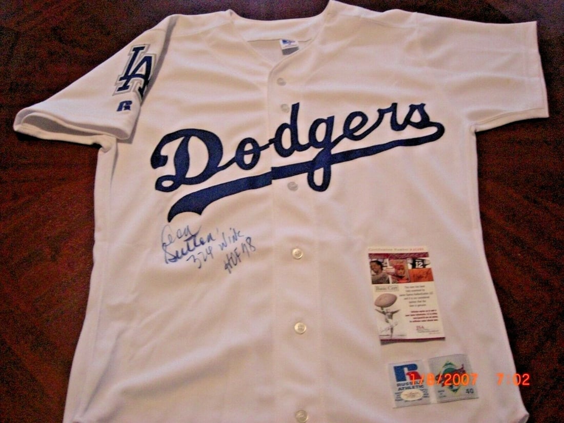 Autographed Russell Dodgers Jersey Don Sutton Hall of Fame 1998 JSA COA: Autographed Russell Dodgers Jersey Don Sutton Hall of Fame 1998 JSA COA This is an official licensed Russell jersey signed by Don Sutton, commemorating his career with the Dodgers and his Hall of Fame