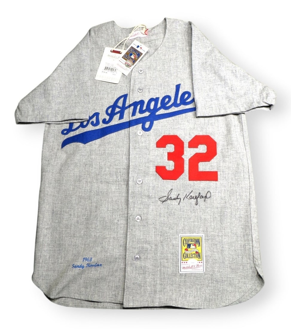 Sandy Koufax Autographed 1963 Dodgers Jersey JSA Certified: Sandy Koufax Autographed 1963 Dodgers Jersey JSA Certified This is an original, pre-owned jersey autographed by Sandy Koufax, a legendary player of the Los Angeles Dodgers. The jersey is size 44 (L) a