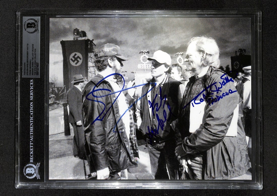 Indiana Jones Multi-Signed 8x10 Photo by Spielberg Marshall Watts Beckett Authenticated: Indiana Jones Multi-Signed 8x10 Photo by Spielberg Marshall Watts Beckett Authenticated This original autographed 8x10 black and white photograph features three prominent figures from the Indiana Jone