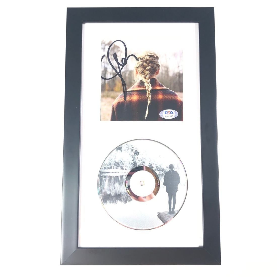 Taylor Swift Evermore Signed CD Cover Framed PSA/DNA Authenticated: Taylor Swift Evermore Signed CD Cover Framed PSA/DNA Authenticated This exquisite item features a framed CD album cover of Taylor Swift's 'Evermore', beautifully autographed by the artist herself. The