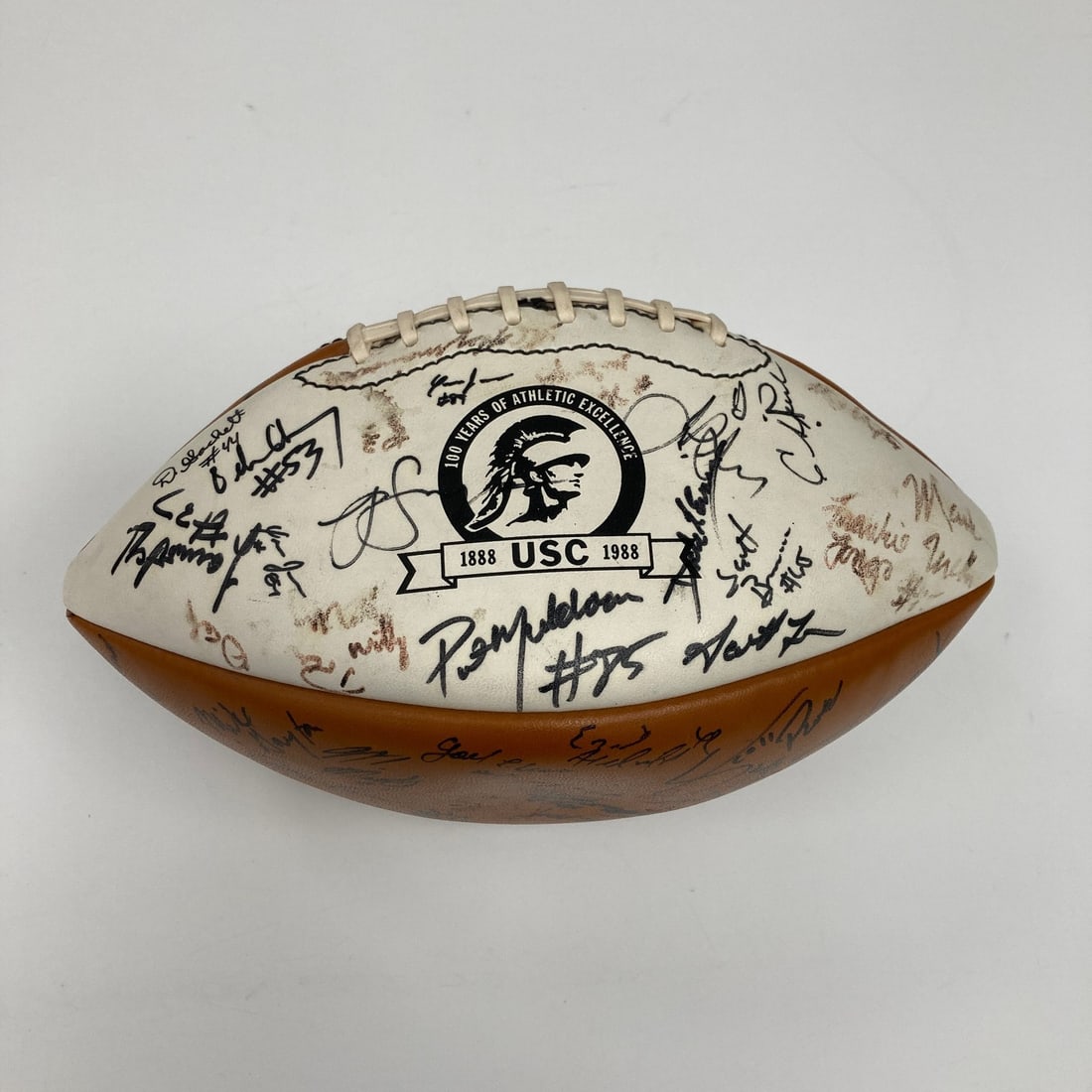 USC Trojans 1988 Pac-10 Champions Football Signed by Team and Rodney Peete: USC Trojans 1988 Pac-10 Champions Football Signed by Team and Rodney Peete This is an original football featuring signatures from the 1988 Pac-10 Champion USC Trojans team. The Wilson football display