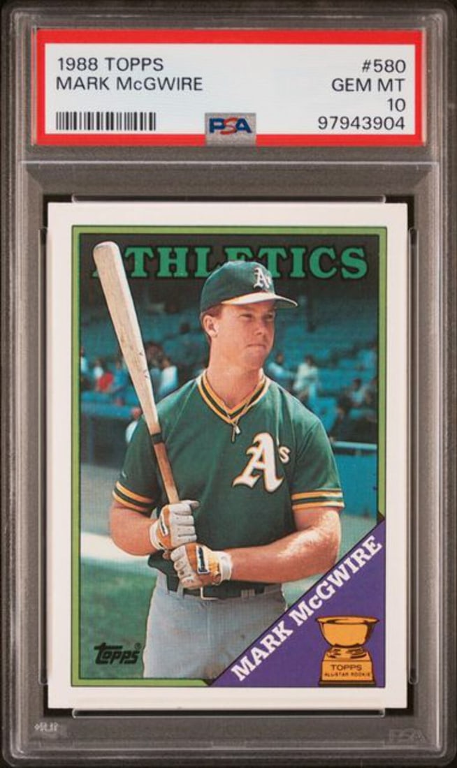 1988 Topps Mark McGwire #580 PSA 10 Mint MLB Card: 1988 Topps Mark McGwire #580 PSA 10 Mint MLB Card This graded 1988 Topps Mark McGwire #580 2nd Year Baseball Card is a must-have for collectors. It has achieved a perfect PSA 10 Gem Mint grade, ensuri