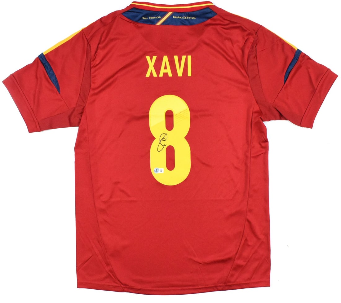 Spain Soccer Jersey Signed by Xavi with Beckett Hologram Authentication: Spain Soccer Jersey Signed by Xavi with Beckett Hologram Authentication This Spain home soccer jersey features the signature of Xavi and is marked with the number 8. The jersey is an original item and