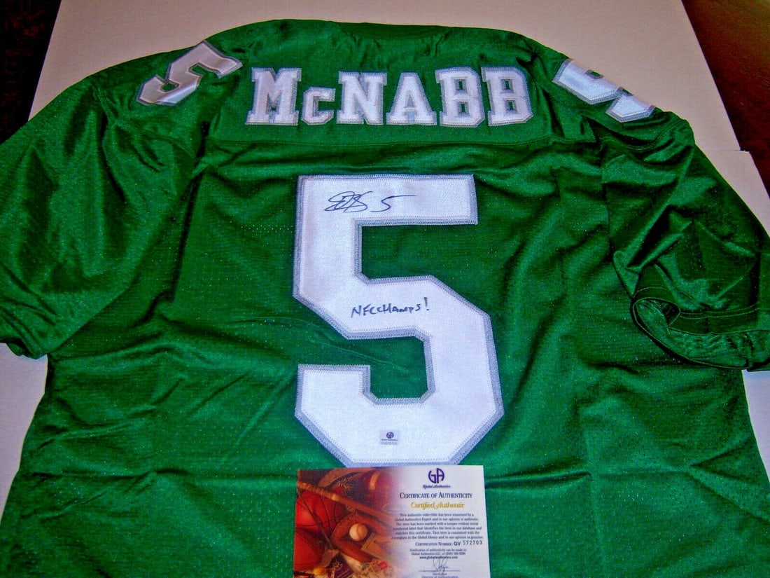 Philadelphia Eagles NFC Champions Jersey Signed by Donovan McNabb with GAI COA: Philadelphia Eagles NFC Champions Jersey Signed by Donovan McNabb with GAI COA This is a pre-owned Philadelphia Eagles jersey signed by Donovan McNabb, commemorating the team's NFC Championship. The j