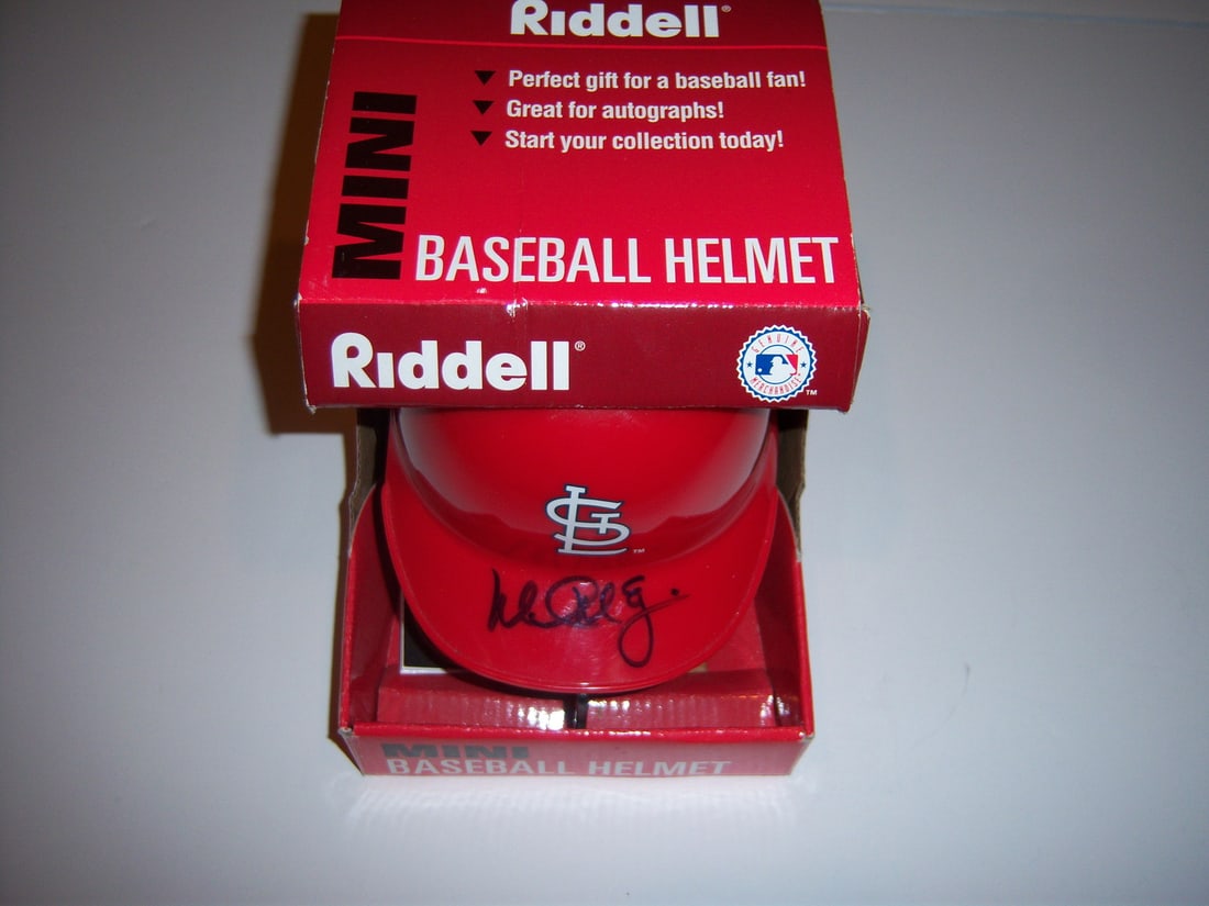 Autographed St Louis Cardinals Mini Helmet Mark McGwire With COA: Autographed St Louis Cardinals Mini Helmet Mark McGwire With COA This is a pre-owned St. Louis Cardinals mini helmet, personally signed by Mark McGwire. The helmet comes with a certificate of authenti
