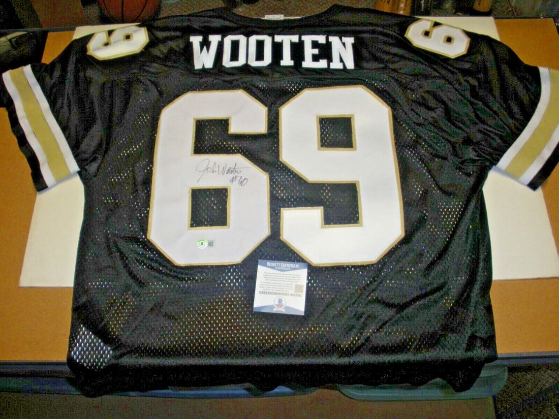 John Wooten Signed Nike Jersey with Beckett COA NFL: John Wooten Signed Nike Jersey with Beckett COA NFL This official licensed Nike jersey features the name of John Wooten, a notable figure in NFL football. It is an original item, not a reprint, making