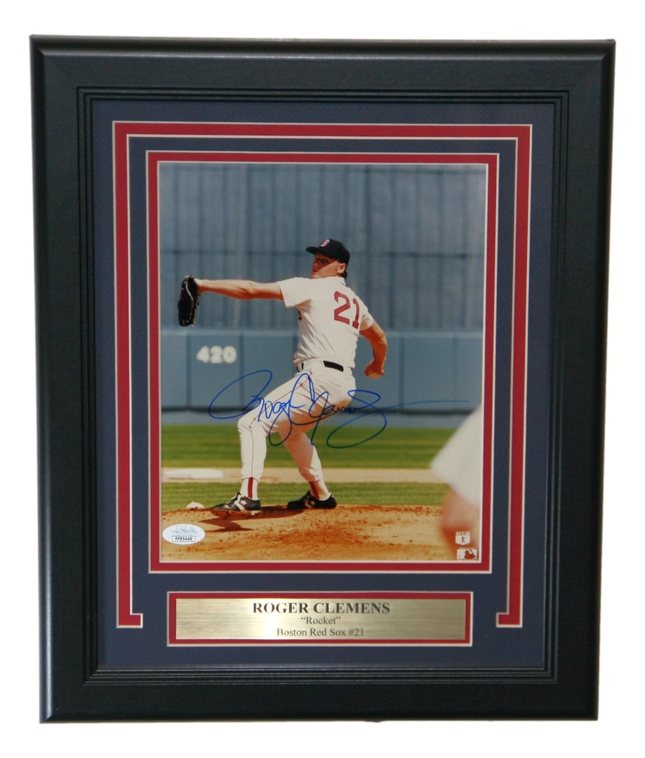 Roger Clemens Signed Framed Boston Red Sox Photo JSA Authenticated: Roger Clemens Signed Framed Boston Red Sox Photo JSA Authenticated This stunning framed photo captures Roger Clemens in action as a member of the Boston Red Sox. The 8x10 image is autographed by the l