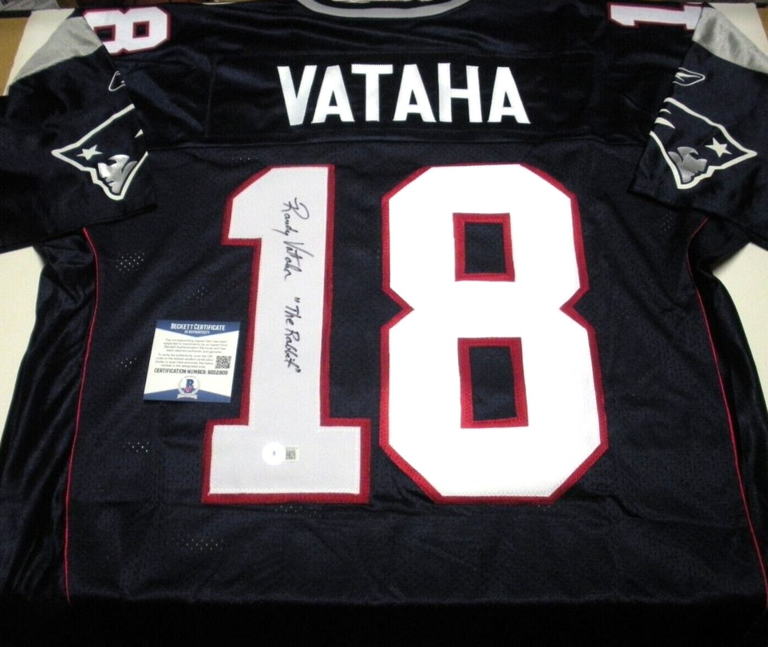 Randy Vataha Signed Reebok Patriots Jersey with COA: Randy Vataha Signed Reebok Patriots Jersey with COA This officially licensed Reebok jersey, signed by Randy Vataha, is a must-have collectible for any NFL fan. The jersey features a vibrant design rep