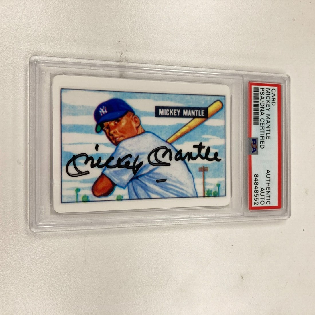 1951 Bowman Mickey Mantle Signed Rookie Baseball Card PSA Certified: 1951 Bowman Mickey Mantle Signed Rookie Baseball Card PSA Certified This is a 1951 Bowman Mickey Mantle Signed Porcelain Baseball Card, a significant piece for any baseball card collector. This rookie