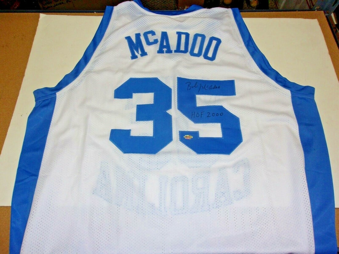 Bob McAdoo North Carolina Tarheels Signed Jersey with COA HOF 2000: Bob McAdoo North Carolina Tarheels Signed Jersey with COA HOF 2000 This authentic signed jersey features Bob McAdoo, a Hall of Famer from the North Carolina Tarheels, showcasing his legacy in basketba