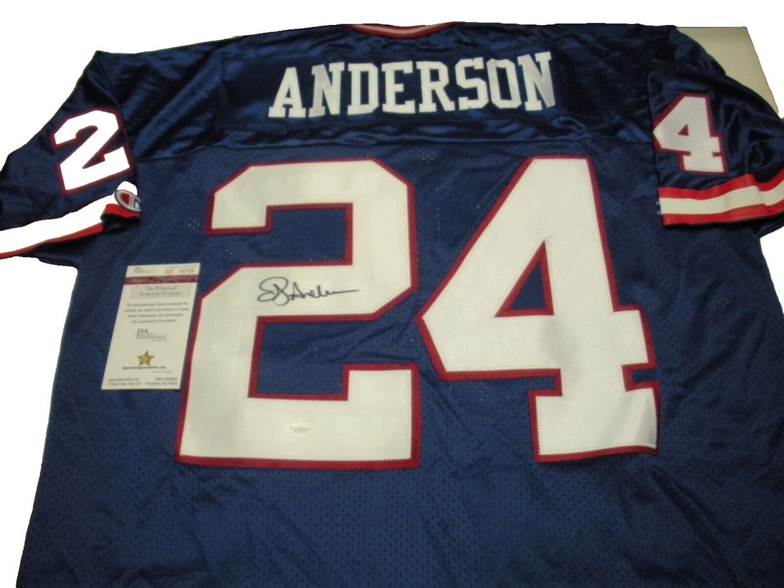 OJ Anderson New York Giants Signed Champion Jersey JSA Certified: OJ Anderson New York Giants Signed Champion Jersey JSA Certified This is an officially licensed Champion jersey signed by O.J. Anderson, a celebrated player from the New York Giants. The jersey is an 