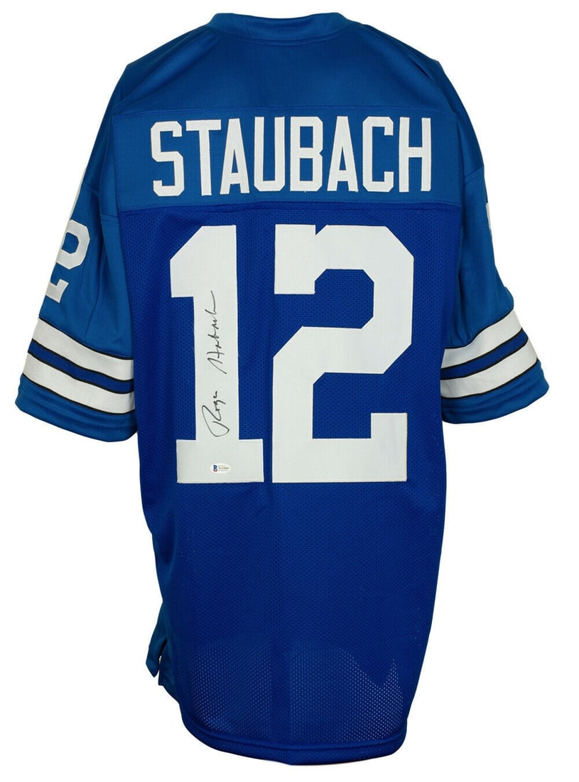Dallas Cowboys Blue Football Jersey Signed by Roger Staubach Beckett Authenticated: Dallas Cowboys Blue Football Jersey Signed by Roger Staubach Beckett Authenticated This pre-owned Dallas Cowboys blue football jersey features the autograph of Roger Staubach. The jersey is an origina