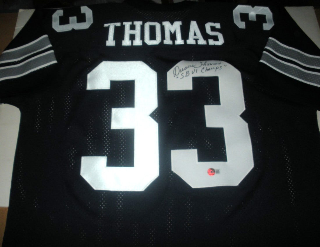 Duane Thomas Dallas Cowboys Signed Licensed Logo Jersey with COA: Duane Thomas Dallas Cowboys Signed Licensed Logo Jersey with COA This officially licensed Dallas Cowboys jersey is signed by Duane Thomas, a notable player in NFL history. The jersey is in pre-owned c