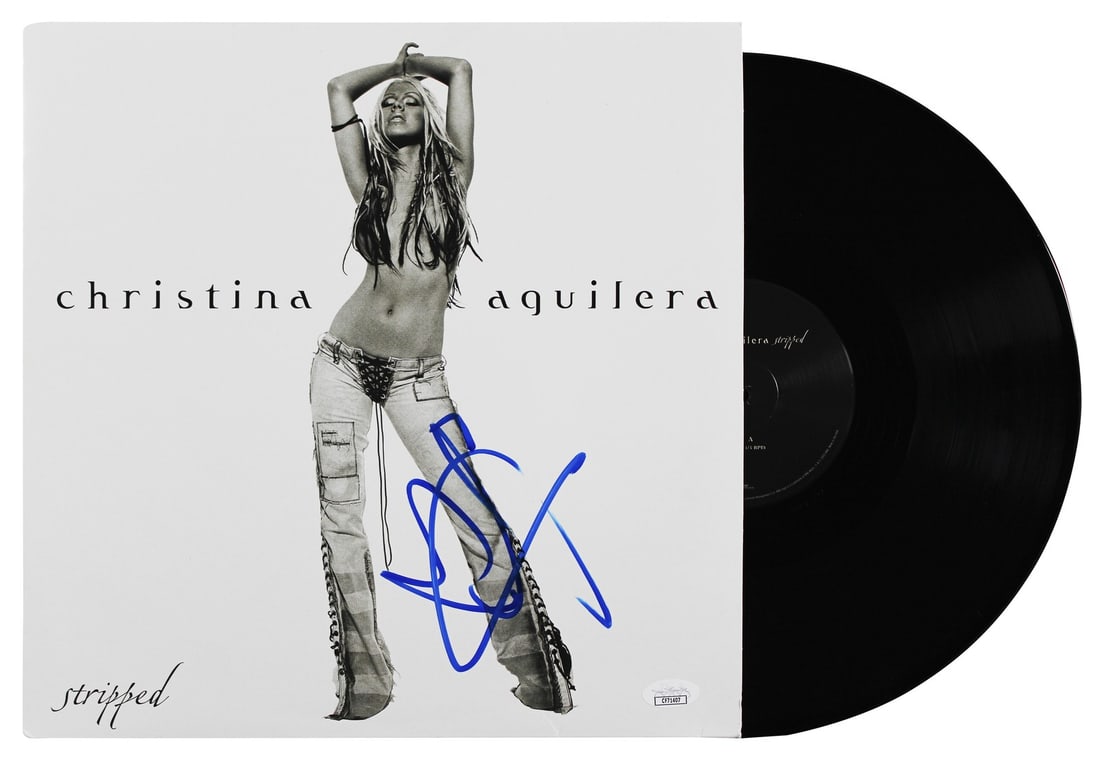 Signed Stripped Album Cover and Vinyl by Christina Aguilera with JSA Authentication: Signed Stripped Album Cover and Vinyl by Christina Aguilera with JSA Authentication This original "Stripped" album cover with vinyl has been personally signed by Christina Aguilera. The autograph is a