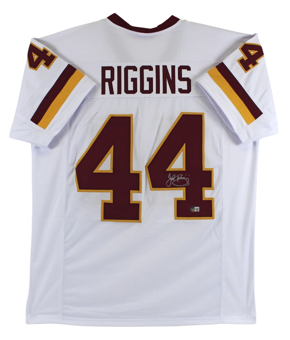 John Riggins Signed White Pro Style Jersey With Beckett Authentication: John Riggins Signed White Pro Style Jersey With Beckett Authentication This white pro style jersey has been personally signed by John Riggins of the Washington Football Team. The autograph was witness
