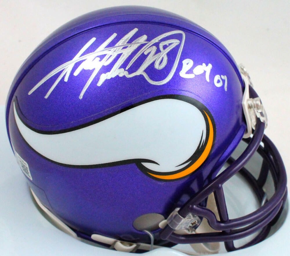 Minnesota Vikings Mini Helmet Autographed by Adrian Peterson Beckett Authenticated: Minnesota Vikings Mini Helmet Autographed by Adrian Peterson Beckett Authenticated This Minnesota Vikings mini helmet features the signature and inscription of Adrian Peterson. The autograph has been 