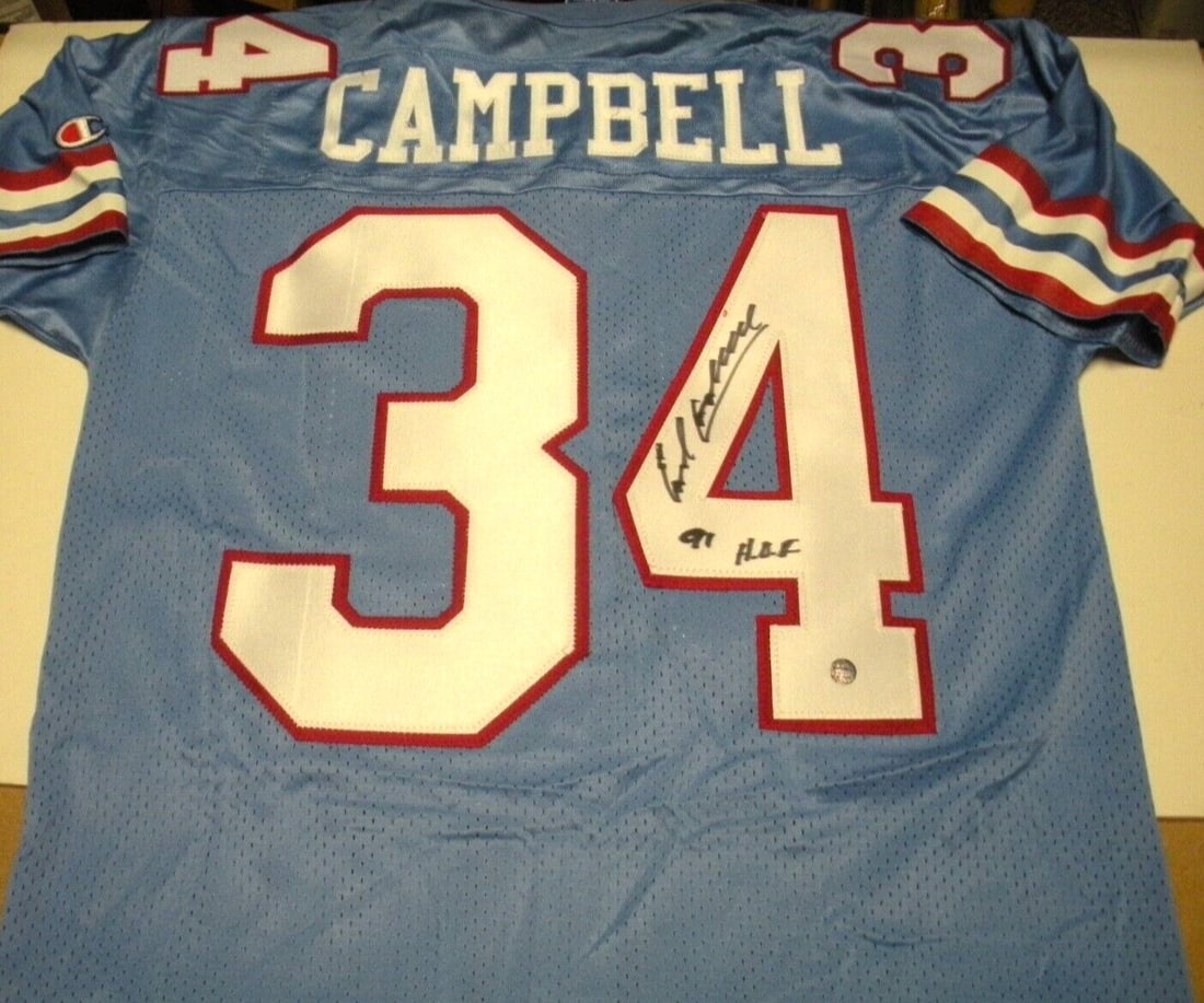 Signed Earl Campbell Champion Jersey with COA Houston Oilers Hall of Fame: Signed Earl Campbell Champion Jersey with COA Houston Oilers Hall of Fame This officially licensed Champion jersey is signed by Earl Campbell, a Hall of Fame player for the Houston Oilers. The jersey 