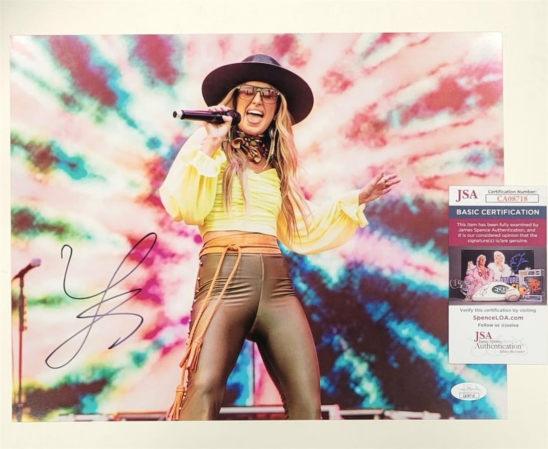 11x14 Lainey Wilson Autographed Photo with JSA Authentication: 11x14 Lainey Wilson Autographed Photo with JSA Authentication This 11x14 photo features the autograph of country music star Lainey Wilson. The signature is authenticated by James Spence Authentication