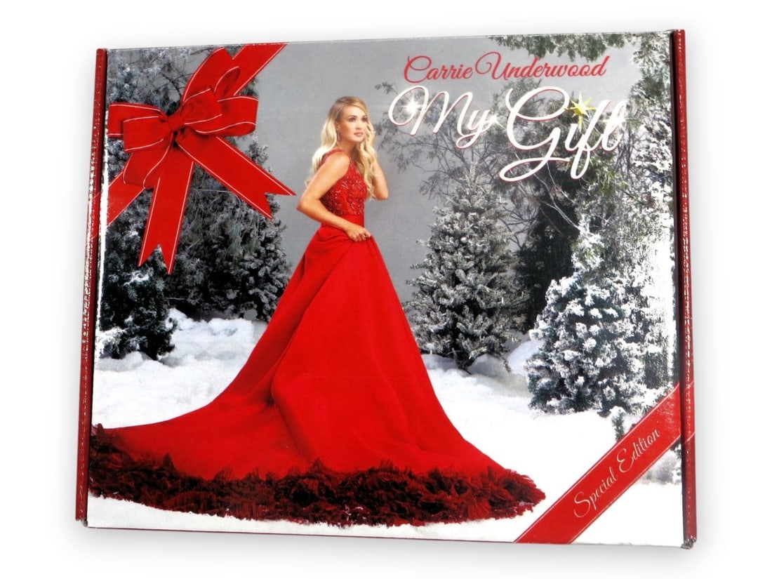 Carrie Underwood Autographed CD Insert Collector's Set with JSA Authentication: Carrie Underwood Autographed CD Insert Collector's Set with JSA Authentication This collector's set features a Carrie Underwood autographed CD insert, a must-have for any fan. Included is a T-shirt in