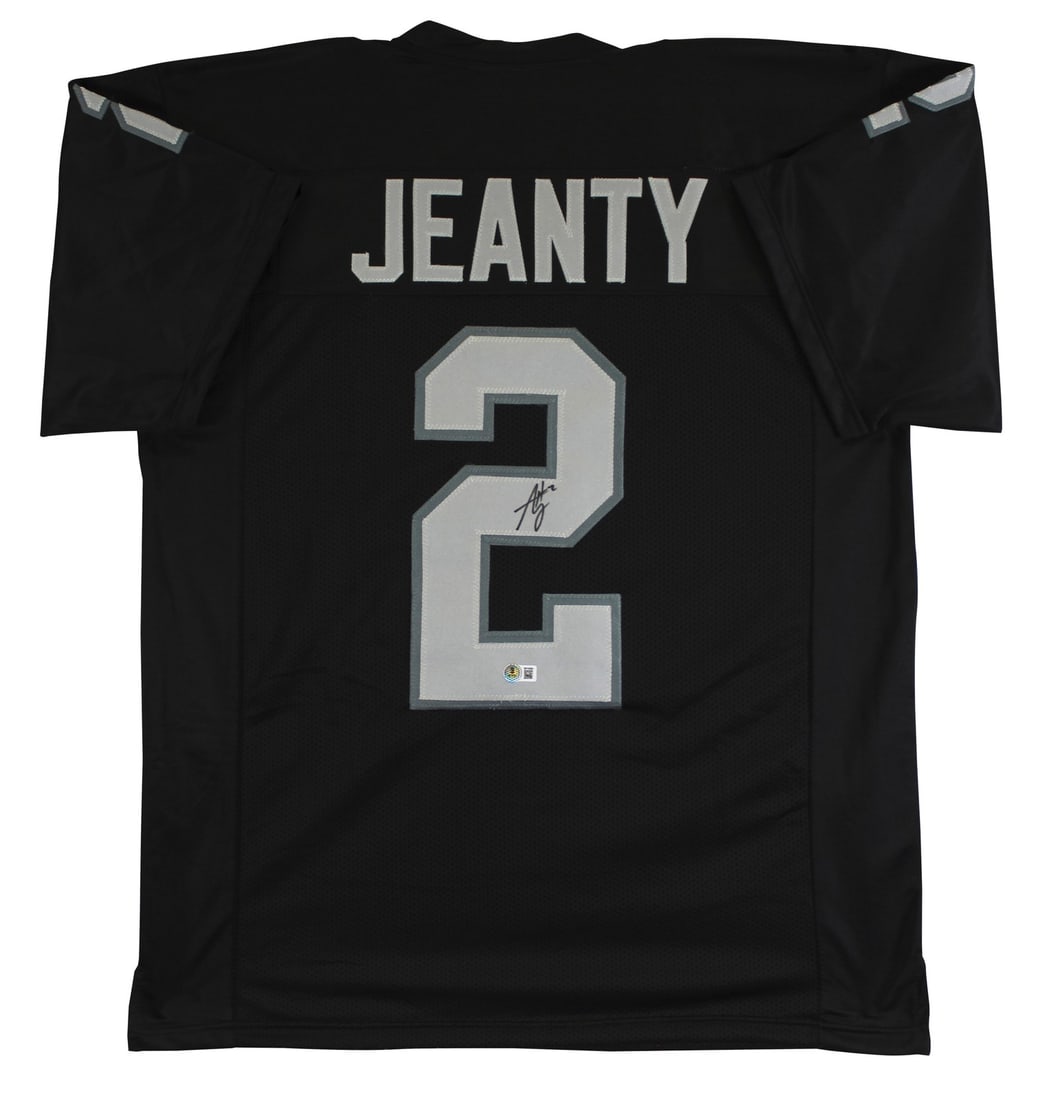Ashton Jeanty Signed Black Pro Style Jersey Las Vegas Raiders BAS Witnessed: Ashton Jeanty Signed Black Pro Style Jersey Las Vegas Raiders BAS Witnessed This Authentic Signed Black Pro Style Jersey is personally autographed by Ashton Jeanty of the Las Vegas Raiders. It feature